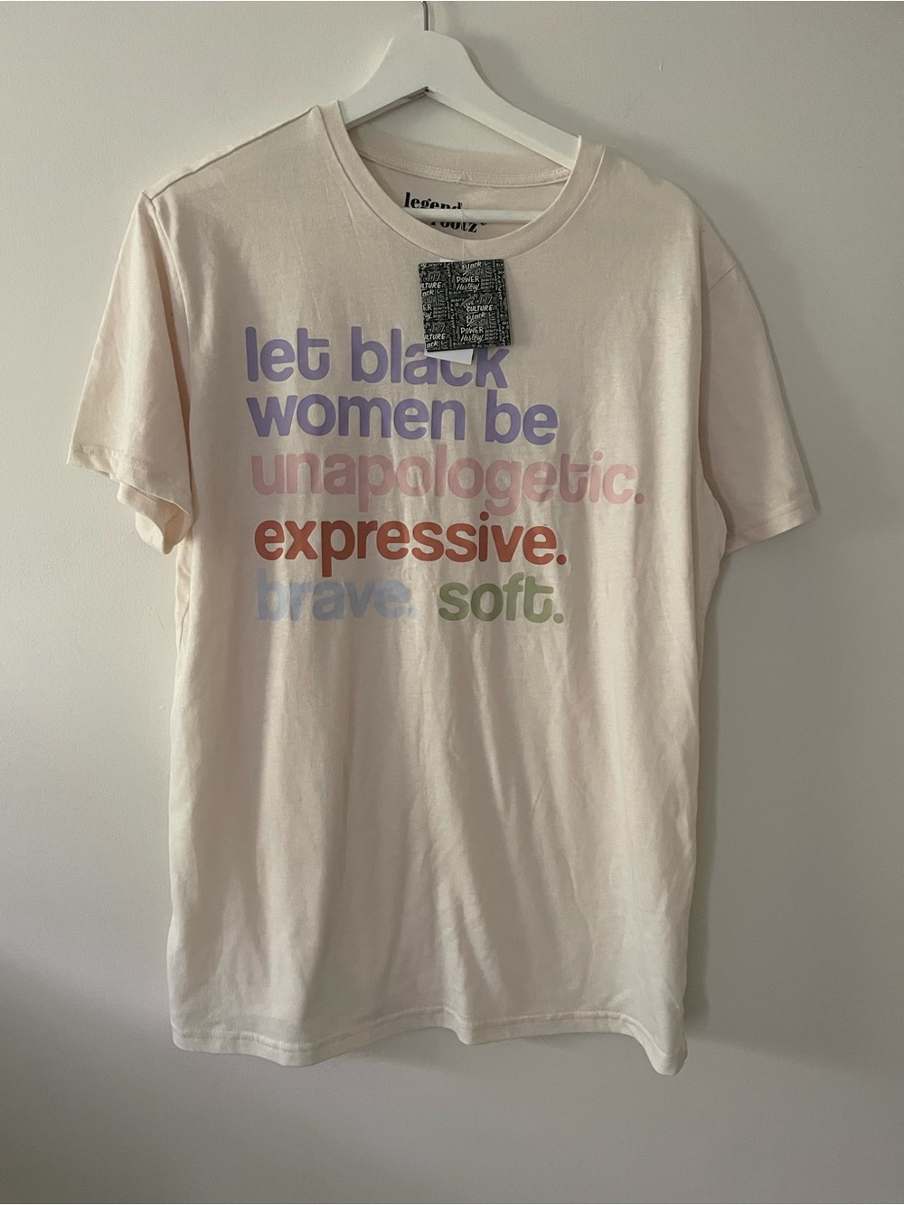 Off-White Pale Pink Graphic Tee with Multicolor Slogan